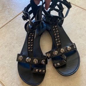 STEVE MADDEN: black patent and studded sandals.
